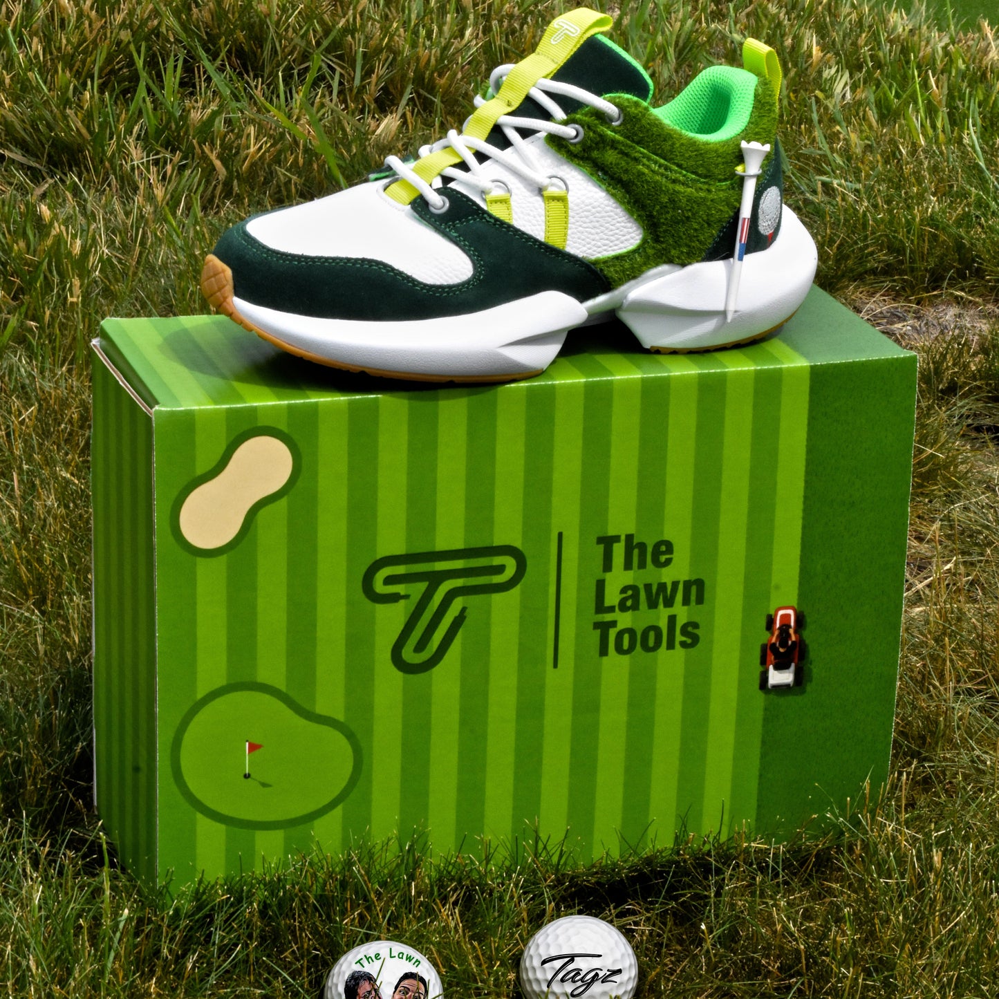 Golf shoe with green accents on a green box labeled 'The Lawn Tools' in a grassy outdoor setting.
