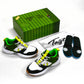 Green and black athletic shoes with a green box and white insole packaging on a white background